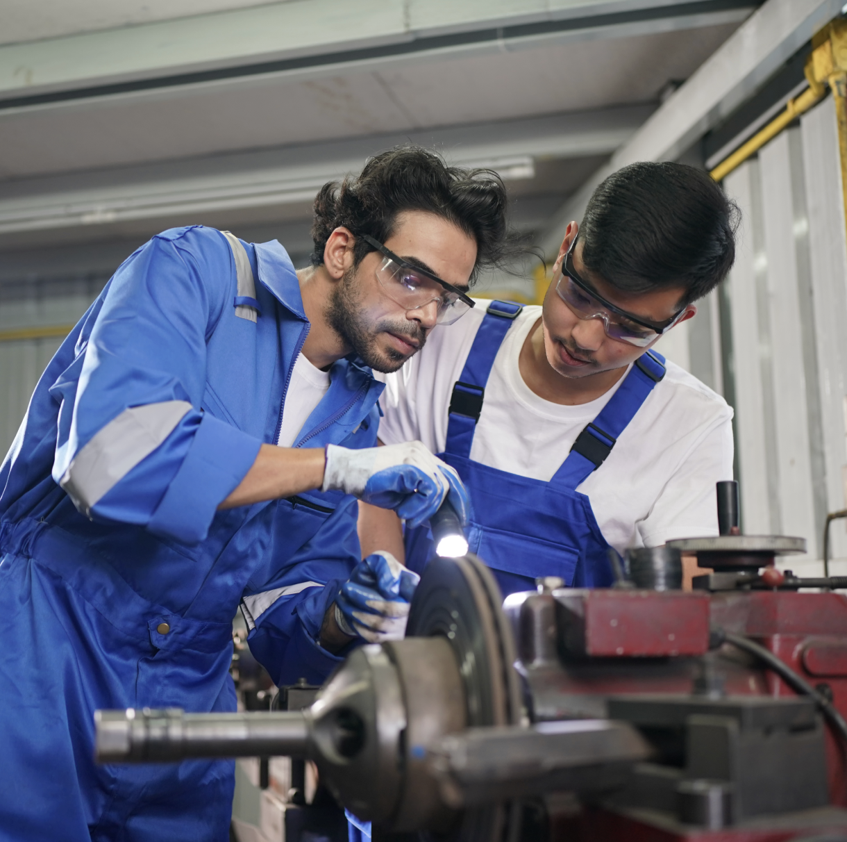Mechanics working on an engine