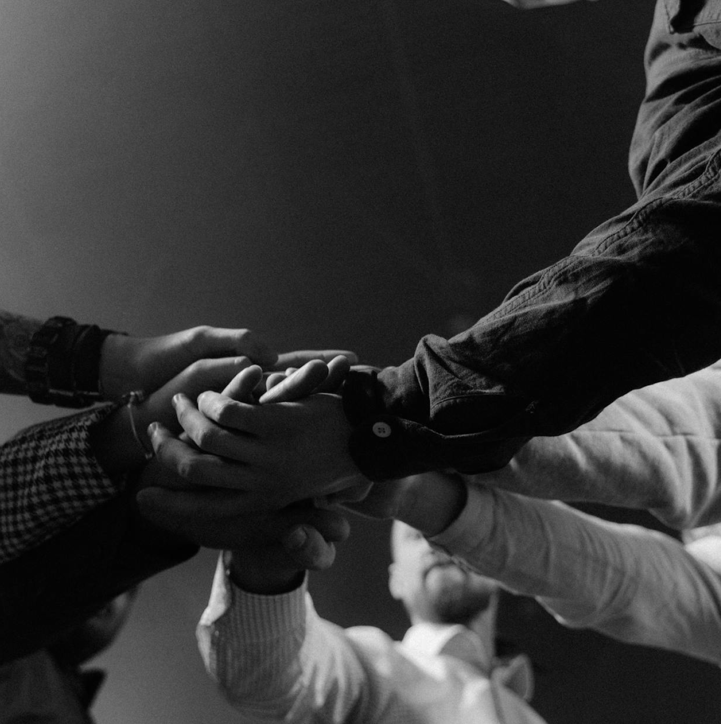 Diverse hands joined together